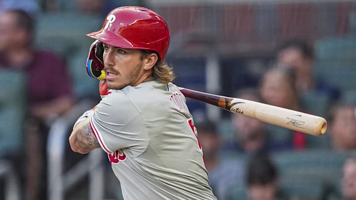 Aug 20, 2024; Cumberland, Georgia, USA; Philadelphia Phillies second baseman Bryson Stott (5) singles against the Atlanta Braves during the second inning at Truist Park
