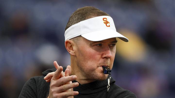 Nov 2, 2024; Seattle, Washington, USA; USC Trojans head coach Lincoln Riley watches pregame warmups against the Washington Huskies at Alaska Airlines Field at Husky Stadium. Nov 2, 2024; Seattle, Washington, USA; USC Trojans head coach Lincoln Riley watches pregame warmups against the Washington Huskies at Alaska Airlines Field at Husky Stadium.