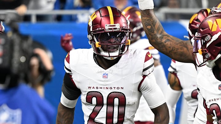 Jan 18, 2025; Detroit, Michigan, USA; Washington Commanders defensive back Quan Martin (20) celebrates a touchdown after an interception during the second quarter against Detroit Lions in a 2025 NFC divisional round game at Ford Field. Mandatory Credit: Lon Horwedel-Imagn Images