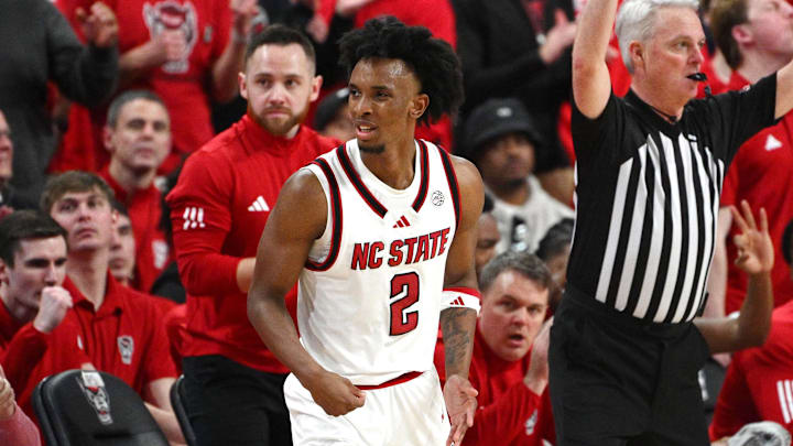 Feb 17, 2026; Raleigh, North Carolina, USA;  NC State Wolfpack guard Paul McNeil Jr. (2) reacts after scoring a basket against the North Carolina Tar Heels during the second half at Lenovo Center. Mandatory Credit: Zachary Taft-Imagn Images