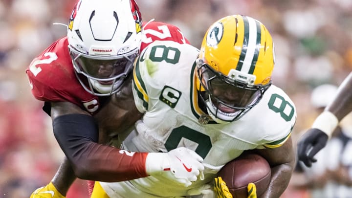 Green Bay Packers running back Josh Jacobs (8) is tackled by Arizona Cardinals linebacker Mack Wilson Sr. 