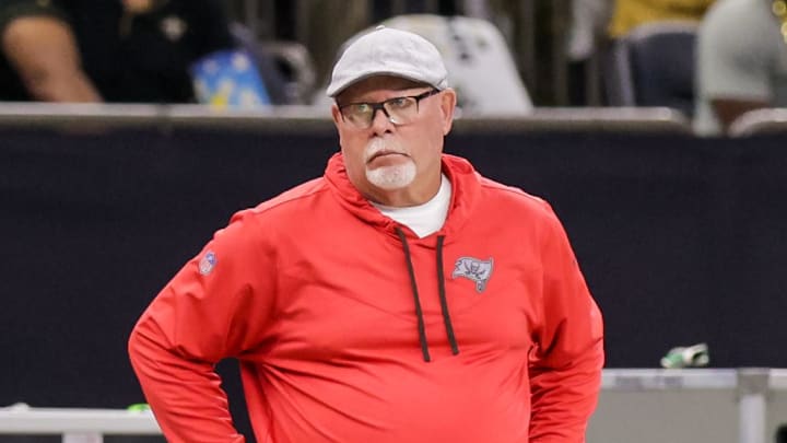 Sep 18, 2022; New Orleans, Louisiana, USA; Tampa Bay Buccaneers Senior Football Consultant Bruce Arians reacts to a play as quarterback Tom Brady (12) looks over the play from the bench against the New Orleans Saints during the first half at Caesars Superdome. Mandatory Credit: Stephen Lew-Imagn Images