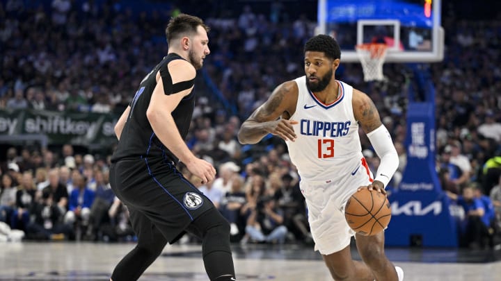 May 3, 2024; Dallas, Texas, USA; LA Clippers forward Paul George (13) moves the ball past Dallas Mavericks guard Luka Doncic (77) during the first quarter during game six of the first round for the 2024 NBA playoffs at American Airlines Center. Mandatory Credit: Jerome Miron-USA TODAY Sports