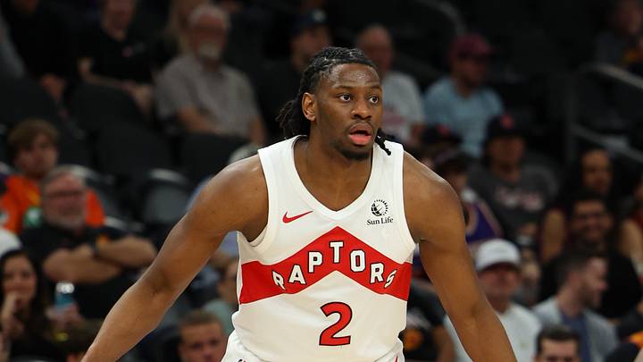 Mar 22, 2026; Phoenix, Arizona, USA; Toronto Raptors forward Jonathan Mogbo (2) dribbles against Phoenix Suns guard Jamaree Bouyea (17) during the fourth quarter at Mortgage Matchup Center. Mandatory Credit: Anna Carrington-Imagn Images Mar 22, 2026; Phoenix, Arizona, USA; Toronto Raptors forward Jonathan Mogbo (2) dribbles against Phoenix Suns guard Jamaree Bouyea (17) during the fourth quarter at Mortgage Matchup Center. Mandatory Credit: Anna Carrington-Imagn Images