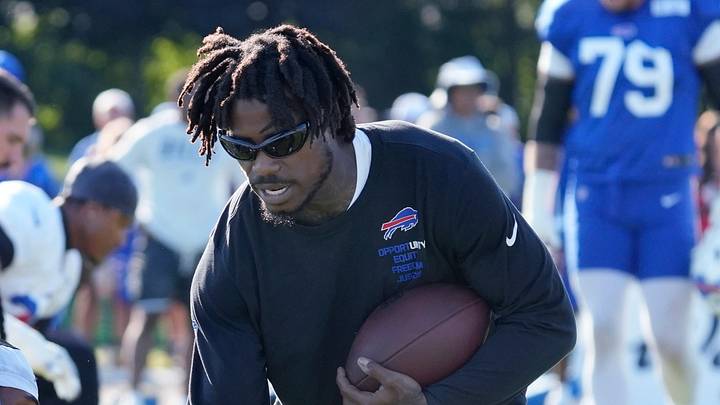 Bills injured defensive back C.J. Gardner-Johnson high-fives teammates during warm ups during day five of Buffalo Bills training camp at St. John Fisher University Tuesday, August 4, 2026 in Pittsford.