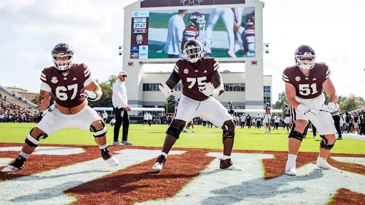 Mississippi State Offensive Lineman Ethan Miner (#67), Mississippi State Offensive Lineman Jacoby Jackson (#75) and Mississippi State Offensive Lineman Luke Work (#51) during the game between the UMass Minute Men and the Mississippi State Bulldogs at Davis Wade Stadium at Scott Field in Starkville, MS. Mississippi State Offensive Lineman Ethan Miner (#67), Mississippi State Offensive Lineman Jacoby Jackson (#75) and Mississippi State Offensive Lineman Luke Work (#51) during the game between the UMass Minute Men and the Mississippi State Bulldogs at Davis Wade Stadium at Scott Field in Starkville, MS.