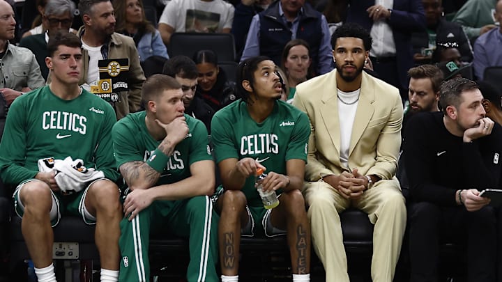 Oct 22, 2025; Boston, Massachusetts, USA; Boston Celtics forward Jayson Tatum (0) sits on the bench with teammates during the second quarter against the Philadelphia 76ers at TD Garden. Mandatory Credit: Winslow Townson-Imagn Images