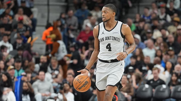 Feb 7, 2026; San Antonio, Texas, USA; San Antonio Spurs guard De'aaron Fox (4) dribbles in the first half against the Dallas Mavericks at Frost Bank Center.