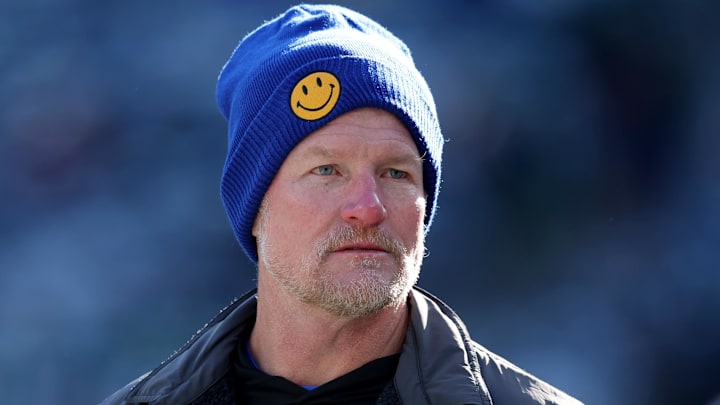 Dec 22, 2024; East Rutherford, New Jersey, USA; Los Angeles Rams general manager Les Snead watches his team warm up before a game against the New York Jets at MetLife Stadium. Mandatory Credit: Brad Penner-Imagn Images