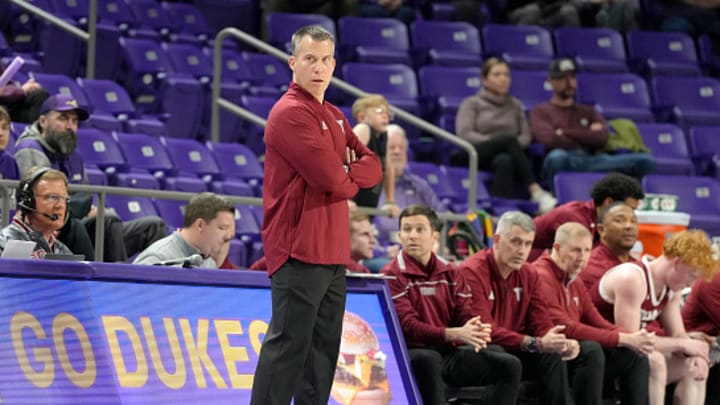 Head coach Scott Cross of the Troy Trojans looks on during a college basketball game against the James Madison Dukes at Atlantic Union Bank Arena on February 5, 2025 in Harrisonburg, Virginia. 