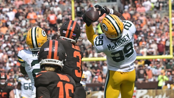 Green Bay Packers safety Xavier McKinney (29) intercepts a pass against the Cleveland Browns