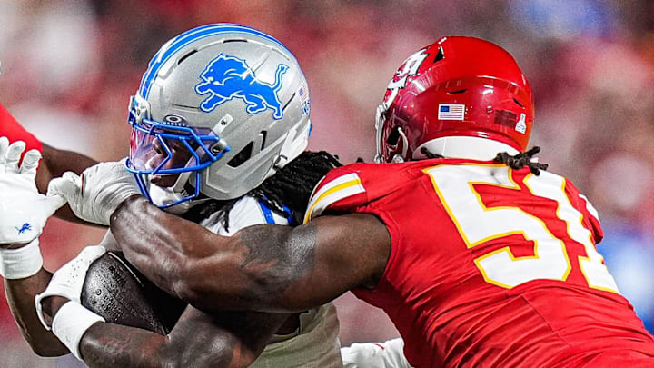 Detroit Lions running back Jahmyr Gibbs (0) runs against Kansas City Chiefs defensive end Mike Danna (51) 
