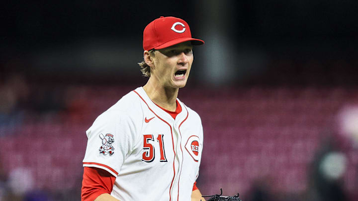 Mar 31, 2025; Cincinnati, Ohio, USA; Cincinnati Reds starting pitcher Brady Singer (51) reacts after a play in the sixth inning against the Texas Rangers at Great American Ball Park. Mandatory Credit: Katie Stratman-Imagn Images