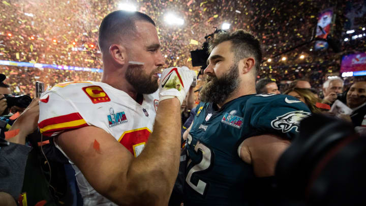 Feb 12, 2023; Glendale, Arizona, US; Kansas City Chiefs tight end Travis Kelce (87) talks with his brother Philadelphia Eagles center Jason Kelce (62) after Super Bowl LVII at State Farm Stadium. Mandatory Credit: Mark J. Rebilas-USA TODAY Sports