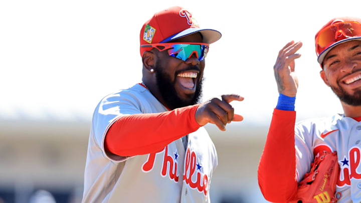 Feb 21, 2026; Dunedin, Florida, USA;  Philadelphia Phillies outfielder Adolis García (53) and infielder Edmundo Sosa (33) smile during the fourth inning against the Toronto Blue Jays at TD Ballpark.