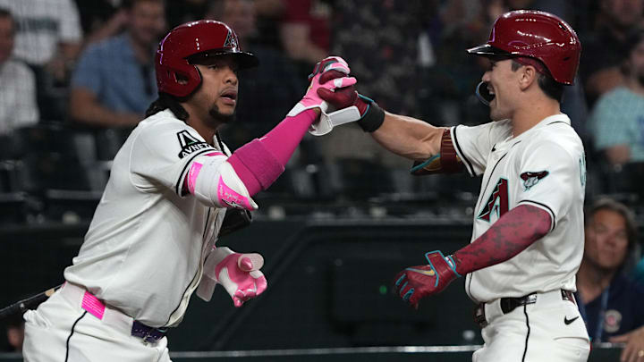 Jun 9, 2025; Phoenix, Arizona, USA; Arizona Diamondbacks outfielder Corbin Carroll (7) celebrates with second base Ketel Marte (4) after hitting a solo home run against the Seattle Mariners in the first inning at Chase Field. Mandatory Credit: Rick Scuteri-Imagn Images