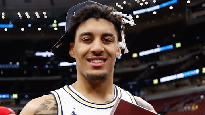 Mar 29, 2026; Chicago, IL, USA; Michigan Wolverines forward Yaxel Lendeborg (23) poses with the Midwest Regional Champion trophy after defeating the Tennessee Volunteers in an Elite Eight game of the men's 2026 NCAA Tournament at United Center. Mandatory Credit: Kamil Krzaczynski-Imagn Images Mar 29, 2026; Chicago, IL, USA; Michigan Wolverines forward Yaxel Lendeborg (23) poses with the Midwest Regional Champion trophy after defeating the Tennessee Volunteers in an Elite Eight game of the men's 2026 NCAA Tournament at United Center. Mandatory Credit: Kamil Krzaczynski-Imagn Images