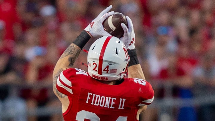 Nebraska tight end Thomas Fidone II catches a pass that turns into a 17-yard gain against Illinois.