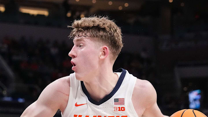 Illinois Fighting Illini guard Kasparas Jakucionis (32) rushes up the court against Iowa Hawkeyes guard Drew Thelwell (3) on Thursday, March 13, 2025, during the second round of the men's Big Ten tournament at Gainbridge Fieldhouse in Indianapolis.