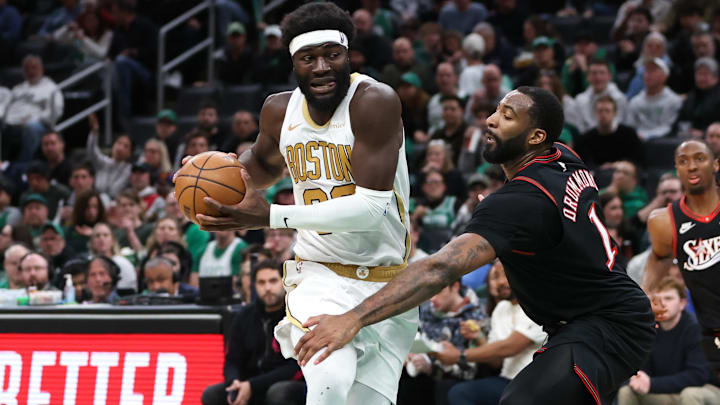 Mar 1, 2026; Boston, Massachusetts, USA; Boston Celtics center Neemias Queta (88) drives to the basket defended by Philadelphia 76ers center Andre Drummond (1) during the second half at TD Garden. Mandatory Credit: Paul Rutherford-Imagn Images