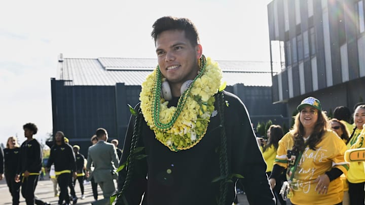 Oct 4, 2024; Eugene, Oregon, USA; Oregon Ducks quarterback Dillon Gabriel (8) visits with family and fans before a game against the Michigan State Spartans at Autzen Stadium. Mandatory Credit: Troy Wayrynen-Imagn Images