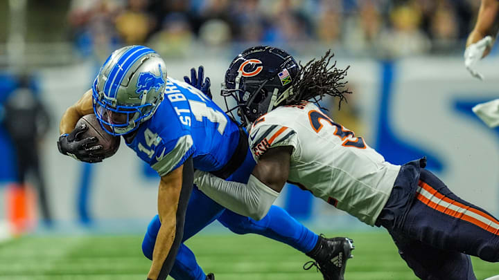 Detroit Lions wide receiver Amon-Ra St. Brown (14) makes a catch against Chicago Bears cornerback Terell Smith (32) Detroit Lions wide receiver Amon-Ra St. Brown (14) makes a catch against Chicago Bears cornerback Terell Smith (32)