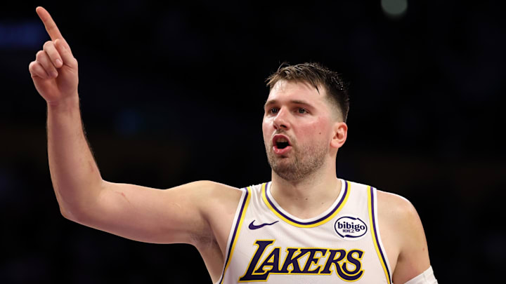 Jan 4, 2026; Los Angeles, California, USA;  Los Angeles Lakers guard Luka Doncic (77) reacts to a play during the third quarter against the Memphis Grizzlies at Crypto.com Arena. Mandatory Credit: Kiyoshi Mio-Imagn Images