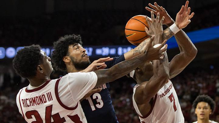 Arkansas Razorbacks guard Billy Richmond III (24) and forward JJ Andrews (7) fight for a rebound against Gonzaga Bulldogs forward Izan Almansa (13) during the second half at Bud Walton Arena. Arkansas Razorbacks guard Billy Richmond III (24) and forward JJ Andrews (7) fight for a rebound against Gonzaga Bulldogs forward Izan Almansa (13) during the second half at Bud Walton Arena.