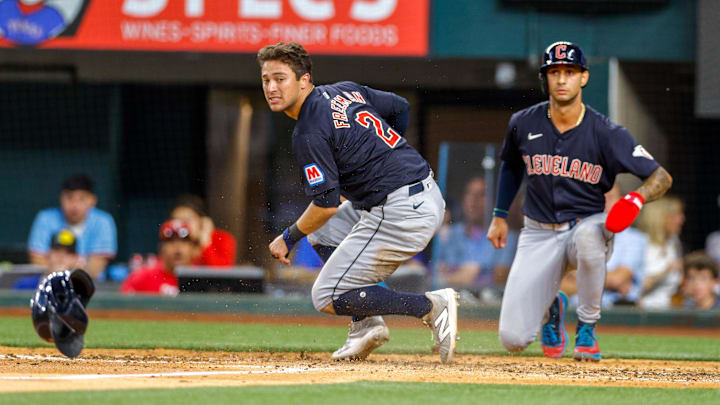 May 13, 2024; Arlington, Texas, USA; Cleveland Guardians outfielder Tyler Freeman (2) and shortstop Brayan Rocchio (4) both come in to score during the eighth inning against the Texas Rangers at Globe Life Field. Mandatory Credit: Andrew Dieb-Imagn Images