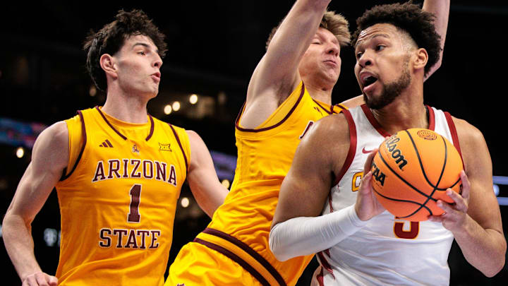 Mar 11, 2026; Kansas City, MO, USA; Iowa State Cyclones forward Joshua Jefferson (5) protects the ball during the first half against the Arizona State Sun Devils at T-Mobile Center.
