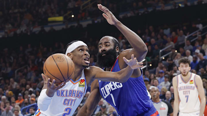 Feb 22, 2024; Oklahoma City, Oklahoma, USA; Oklahoma City Thunder guard Shai Gilgeous-Alexander (2) moves to the basket beside LA Clippers guard James Harden (1) during the second quarter at Paycom Center. Mandatory Credit: Alonzo Adams-Imagn Images Feb 22, 2024; Oklahoma City, Oklahoma, USA; Oklahoma City Thunder guard Shai Gilgeous-Alexander (2) moves to the basket beside LA Clippers guard James Harden (1) during the second quarter at Paycom Center. Mandatory Credit: Alonzo Adams-Imagn Images