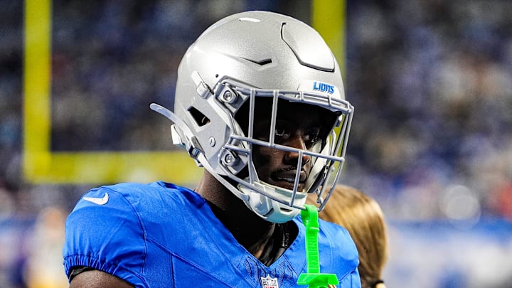 Detroit Lions cornerback Terrion Arnold (6) talks to running backs coach Tashard Rice at warmup ahead of Packers game