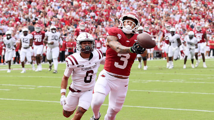 Aug 30, 2025; Fayetteville, Arkansas, USA; Arkansas Razorbacks wide receiver CJ Brown (3) attempts to make a catch in the first quarter as Alabama A&M Bulldogs defensive back Lynn Pettway (6) defends at Donald W. Reynolds Razorback Stadium. Mandatory Credit: Nelson Chenault-Imagn Images