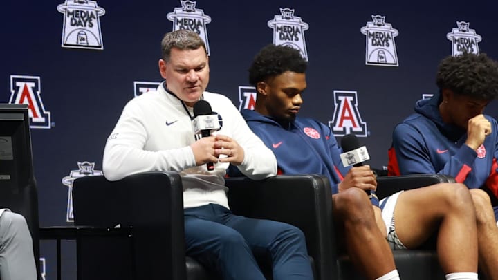Oct 22, 2025; Kansas City, MO, USA; Arizona head coach Tommy Lloyd and players Tobe Awaka, Koa Peat and Jaden Bradley speaks to media during Big 12 Menís Basketball media day at T-Mobile Center. Mandatory Credit: Sophia Scheller-Imagn Images
