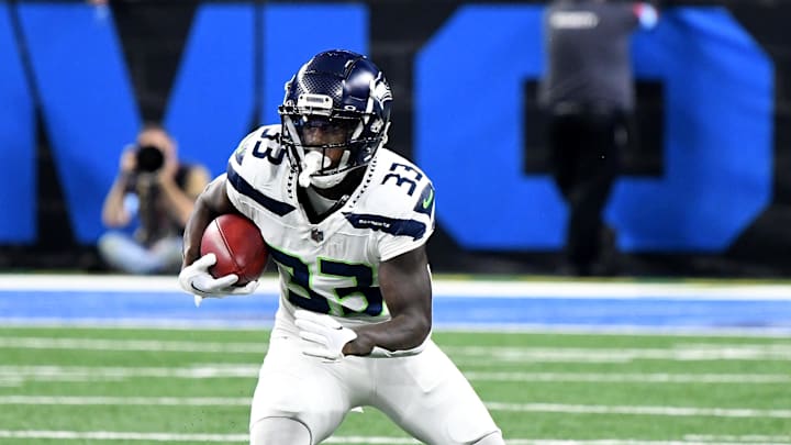 Sep 30, 2024; Detroit, Michigan, USA; Seattle Seahawks cornerback Dee Williams (33) runs the ball against the Detroit Lions in the first quarter at Ford Field. Mandatory Credit: Eamon Horwedel-Imagn Images