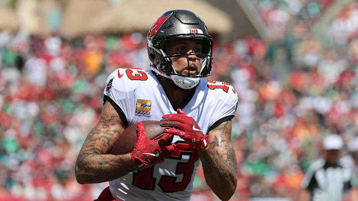 Sep 29, 2024; Tampa, Florida, USA; Tampa Bay Buccaneers wide receiver Mike Evans (13) runs with the ball against the Philadelphia Eagles during the first half at Raymond James Stadium. Mandatory Credit: Kim Klement Neitzel-Imagn Images Sep 29, 2024; Tampa, Florida, USA; Tampa Bay Buccaneers wide receiver Mike Evans (13) runs with the ball against the Philadelphia Eagles during the first half at Raymond James Stadium. Mandatory Credit: Kim Klement Neitzel-Imagn Images