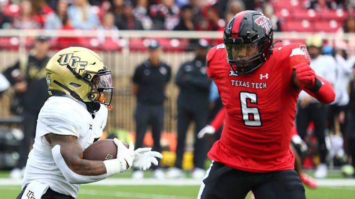 Nov 18, 2023; Lubbock, Texas, USA;  Central Florida Knights running back RJ Harvey (7) rushes