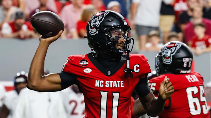 Sep 27, 2025; Raleigh, North Carolina, USA; North Carolina State Wolfpack quarterback CJ Bailey (11) with the ball during the first half of the game against Virginia Tech Hokies at Carter-Finley Stadium. Mandatory Credit: Jaylynn Nash-Imagn Images
