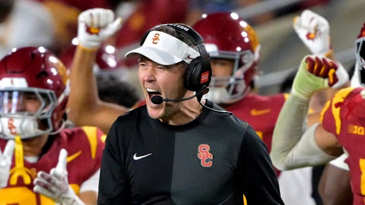 Oct 11, 2025; Los Angeles, California, USA;  USC Trojans head coach Lincoln Riley celebrates after kicker Ryon Sayeri (48) hit a 54-yard field goal in the second half against the Michigan Wolverines at United Airlines Field at the Los Angeles Memorial Coliseum. Mandatory Credit: Jayne Kamin-Oncea-Imagn Images