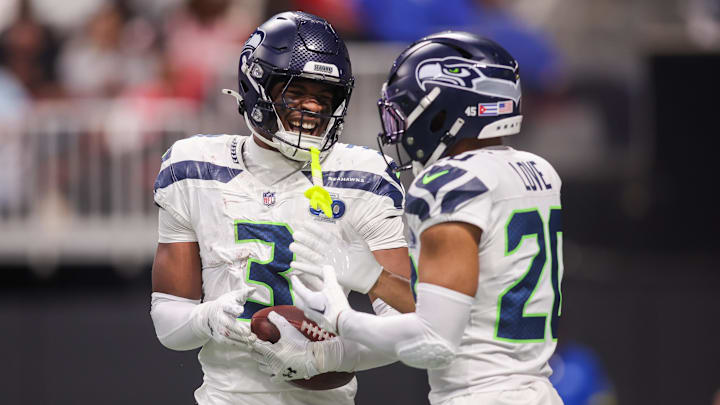 Dec 7, 2025; Atlanta, Georgia, USA; Seattle Seahawks safety Nick Emmanwori (3) celebrates after an interception with safety Julian Love (20) against the Atlanta Falcons in the third quarter at Mercedes-Benz Stadium. Dec 7, 2025; Atlanta, Georgia, USA; Seattle Seahawks safety Nick Emmanwori (3) celebrates after an interception with safety Julian Love (20) against the Atlanta Falcons in the third quarter at Mercedes-Benz Stadium.