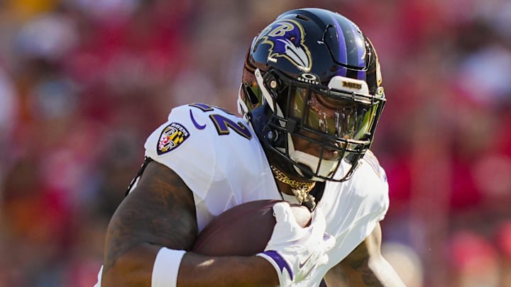 Sep 28, 2025; Kansas City, Missouri, USA; Baltimore Ravens running back Derrick Henry (22) runs the ball during the first half against the Kansas City Chiefs at GEHA Field at Arrowhead Stadium. Mandatory Credit: Jay Biggerstaff-Imagn Images