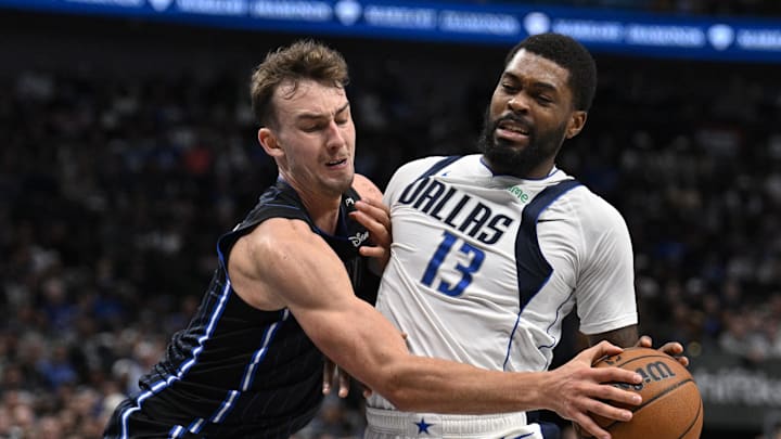 Nov 3, 2024; Dallas, Texas, USA; Dallas Mavericks forward Naji Marshall (13) is fouled by Orlando Magic forward Franz Wagner (22) during the second quarter at the American Airlines Center. Mandatory Credit: Jerome Miron-Imagn Images