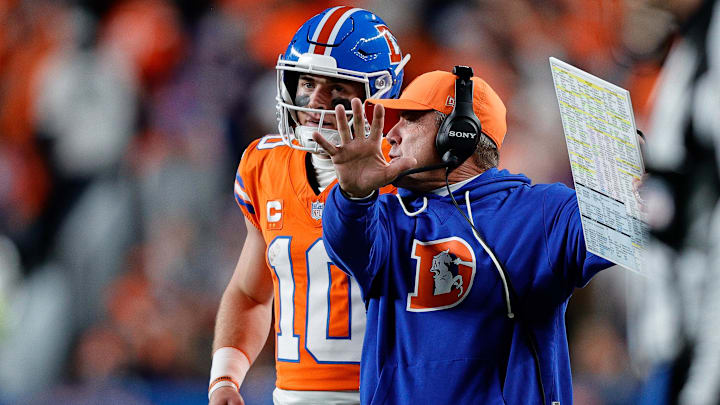 Nov 6, 2025; Denver, Colorado, USA; Denver Broncos quarterback Bo Nix (10) talks with head coach Sean Payton in the fourth quarter against the Las Vegas Raiders at Empower Field at Mile High. 