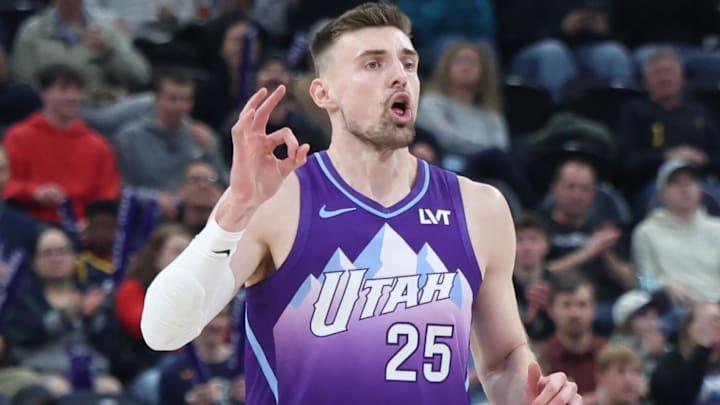 Former Utah Jazz center Micah Potter (25) reacts to a shot against the Portland Trail Blazers during the first half at Delta Center.