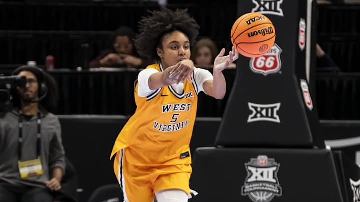 Mar 7, 2026; Kansas City, MO, USA; West Virginia Mountaineers guard Sydney Shaw (5) passes the ball against the Colorado Buffaloes during the second half at T-Mobile Center. Mandatory Credit: Nick Tre. Smith-Imagn Images Mar 7, 2026; Kansas City, MO, USA; West Virginia Mountaineers guard Sydney Shaw (5) passes the ball against the Colorado Buffaloes during the second half at T-Mobile Center. Mandatory Credit: Nick Tre. Smith-Imagn Images