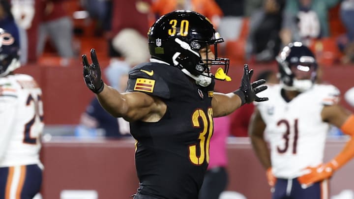 Oct 27, 2024; Landover, Maryland, USA; Washington Commanders running back Austin Ekeler (30) celebrates after the final play of the game against the Chicago Bears at Northwest Stadium. Mandatory Credit: Geoff Burke-Imagn Images