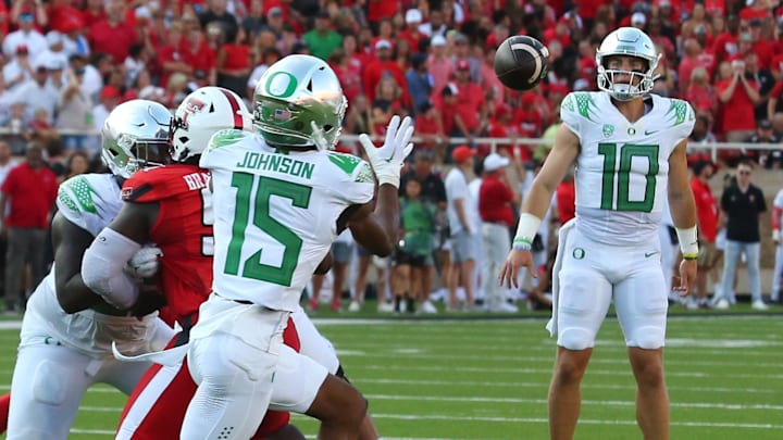 Sep 9, 2023; Lubbock, Texas, USA; Oregon Ducks wide receiver Tez Johnson (15) prepares to make a catch from quarterback Bo Nix (10) against the Texas Tech Red Raiders in the first half at Jones AT&T Stadium and Cody Campbell Field. 
