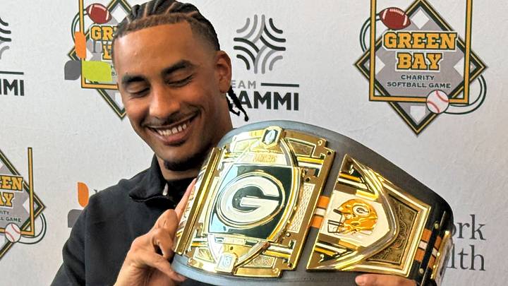 Green Bay Packers QB Jordan Love shows off the belt that went to the winning team in the Green Bay Charity Softball Game. Green Bay Packers QB Jordan Love shows off the belt that went to the winning team in the Green Bay Charity Softball Game.