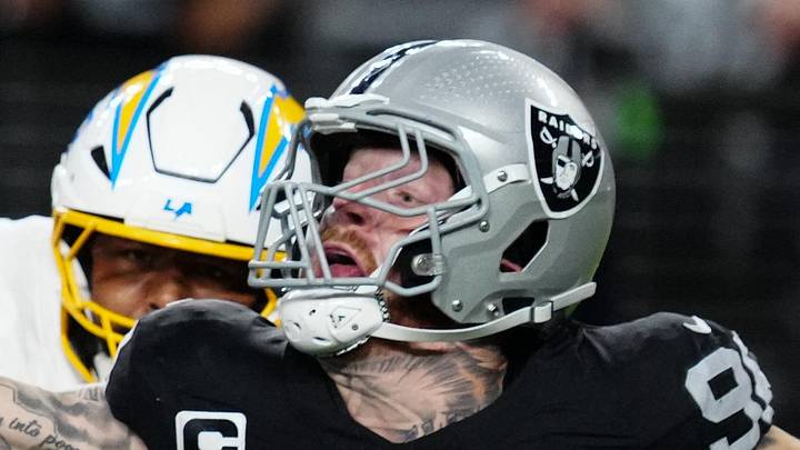 Sep 15, 2025; Paradise, Nevada, USA; Las Vegas Raiders defensive end Maxx Crosby (98) attempts to stop a pass from Los Angeles Chargers quarterback Justin Herbert (10) during the second quarter at Allegiant Stadium. Mandatory Credit: Stephen R. Sylvanie-Imagn Images
