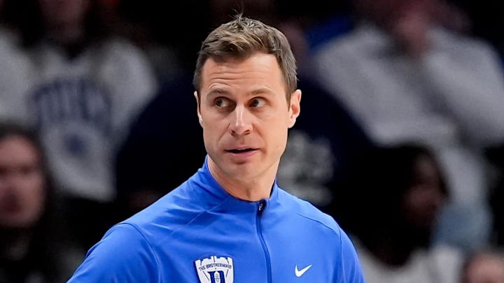 Mar 14, 2026; Charlotte, NC, USA; Duke Blue Devils head coach Jon Scheyer looks on against the Virginia Cavaliers during the men's ACC Conference Tournament Championship at Spectrum Center. Mandatory Credit: Jim Dedmon-Imagn Images Mar 14, 2026; Charlotte, NC, USA; Duke Blue Devils head coach Jon Scheyer looks on against the Virginia Cavaliers during the men's ACC Conference Tournament Championship at Spectrum Center. Mandatory Credit: Jim Dedmon-Imagn Images